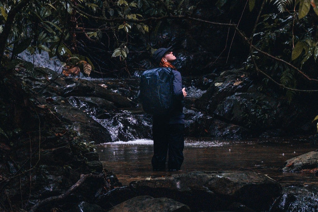 Adventure photographer Grace TSP in Sumatra in the Indonesian Rainfores with the 38L Hybrid Duffle Backpack