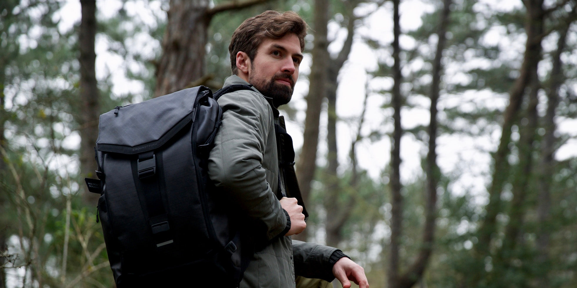 Dr Jack Milln in nature with the GROUNDTRUTH backpack
