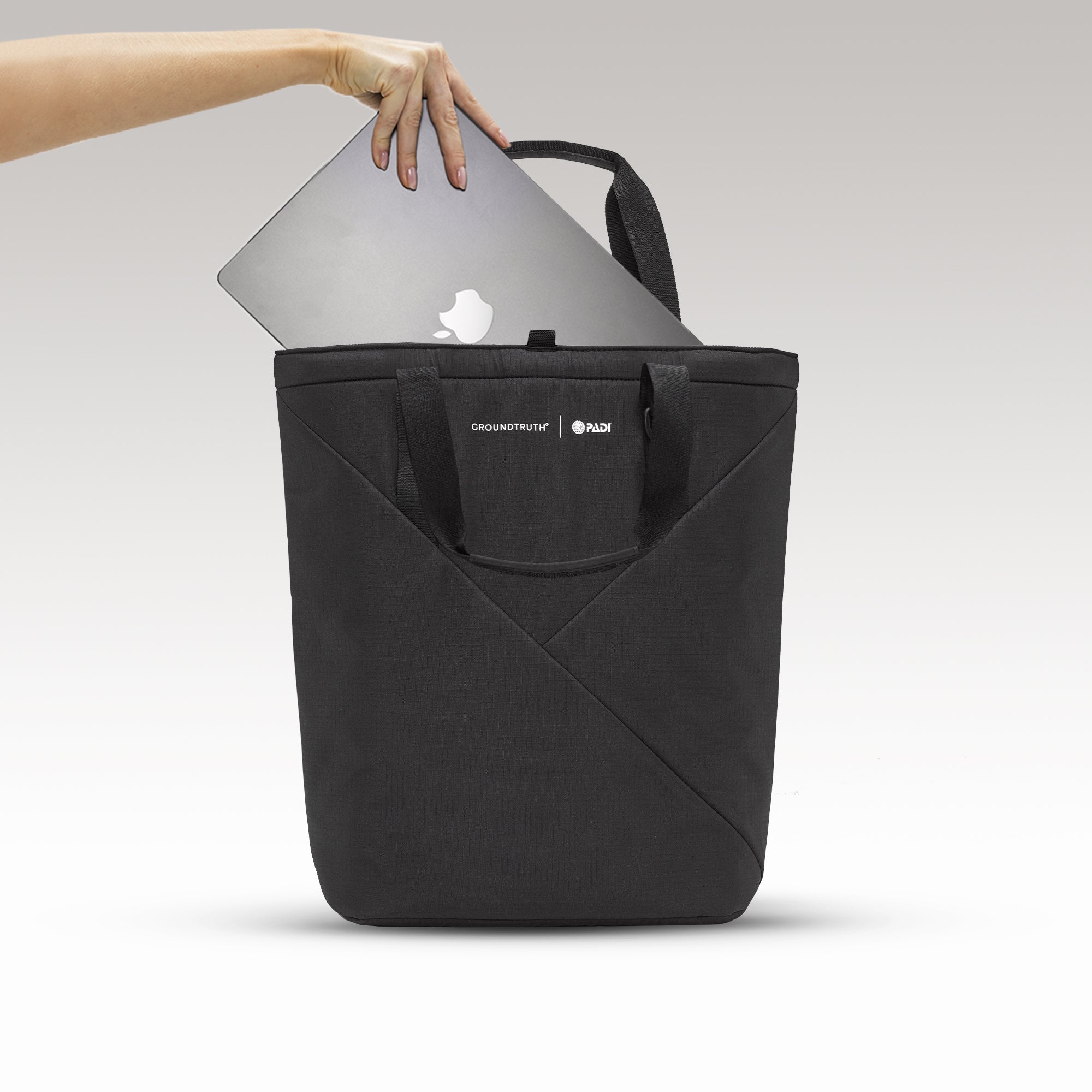 The Day Tote insert fits perfectly in the 25L UNDA backpack with 15" Laptop compartment