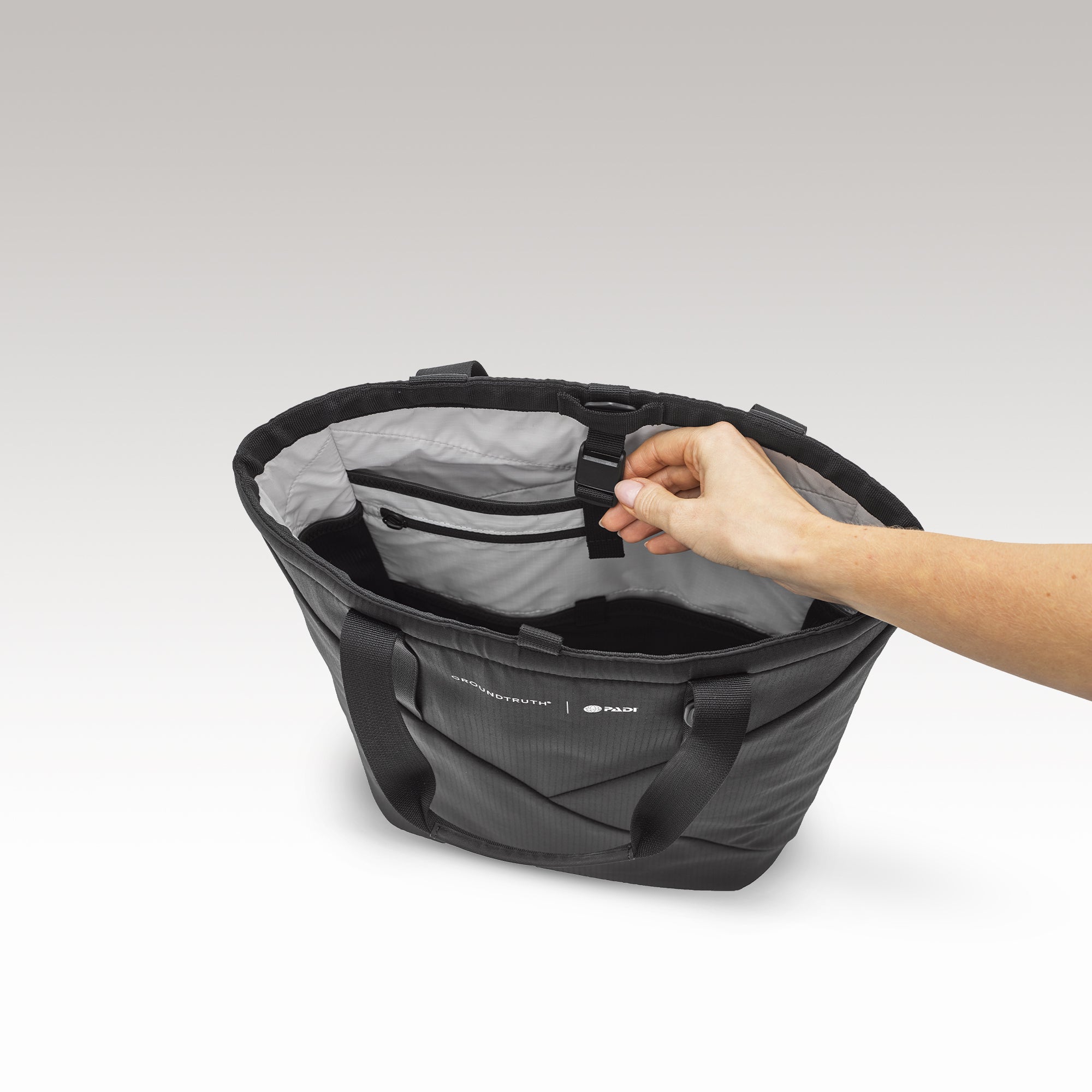 The Day Tote insert fits in the 25L UNDA backpack with 15" Laptop compartment